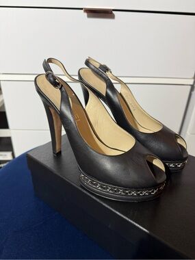 CHANEL Black Leather Peep-Toe Slingback Heels with Chain-Trim Platform